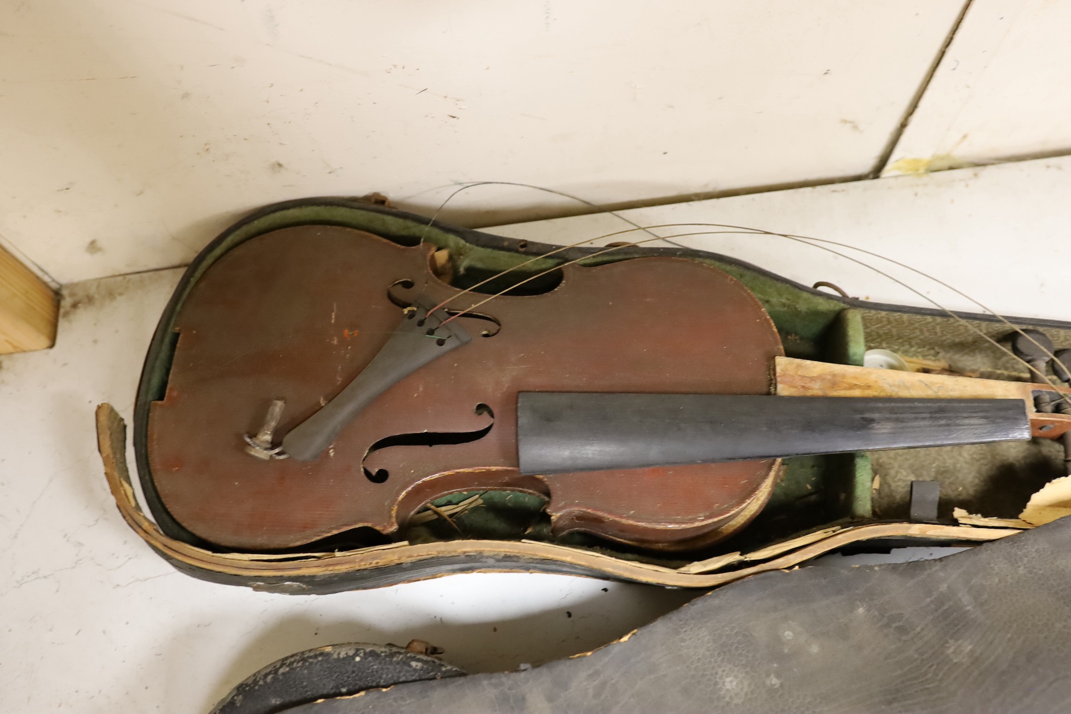A German quarter size violin, a German violin a.f. and a modern violin